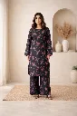 Elegant indoor portrait with floral kurta.webp