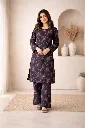 Smiling in a black floral kurta.webp